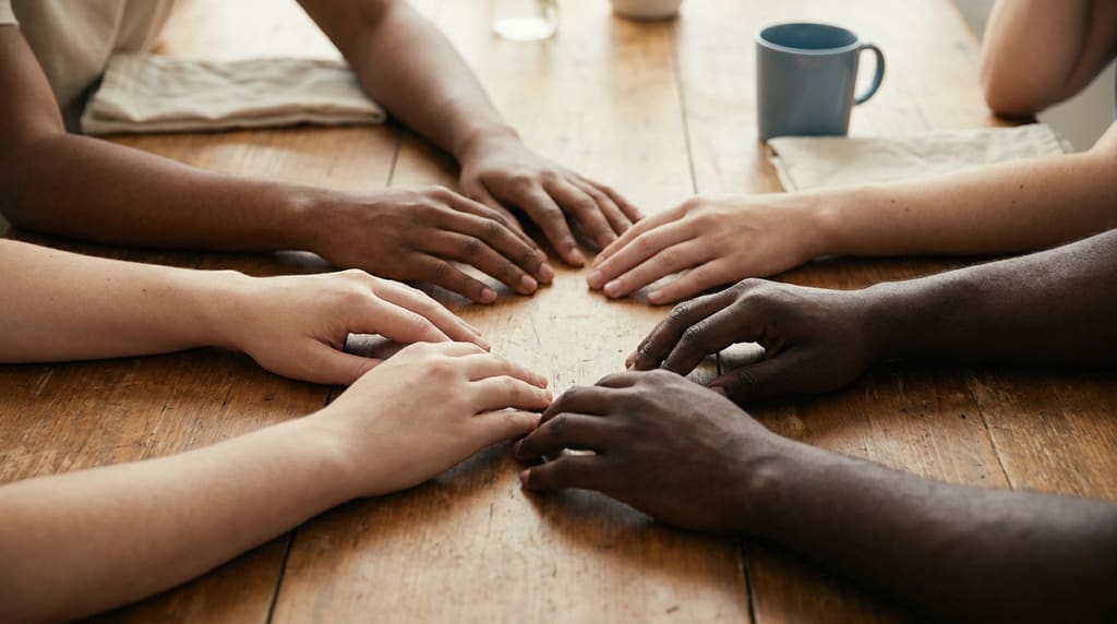 Six forearms of different skin tones laid together — Fitzpatrick I to VI representation